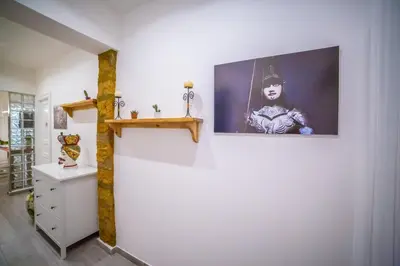 a room with a picture of a woman on the wall at B&B Opera dei Pupi in Palermo