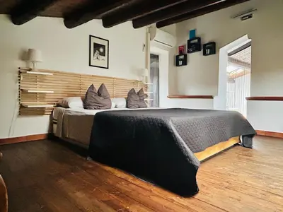 a bedroom with a large bed with pillows on it at Palazzo Rea in Palermo