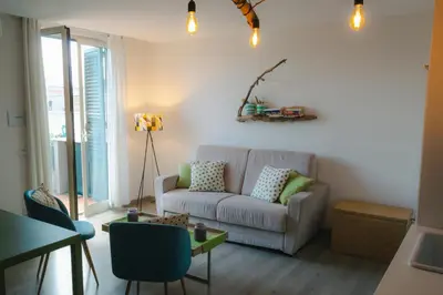 a living room with a couch and a table at Central Apartment with terrace near teatro Massimo in Palermo