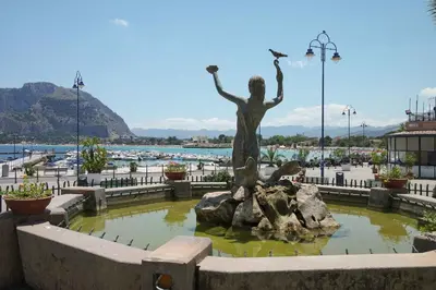 a statue of a woman standing in a fountain at Casa da Silvia in Palermo