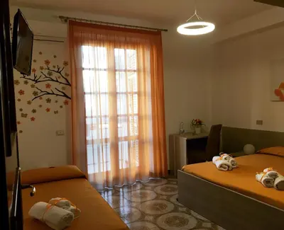 a bedroom with two beds with stuffed animals on them at Alto Giardino Rooms in Terrasini