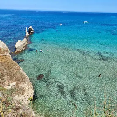 a group of people swimming in the ocean at Alto Giardino Rooms in Terrasini
