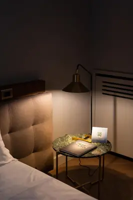 a bed room with a table with a laptop on it at InCanto in Palermo