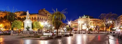 a city square at night with buildings at LOFT 99 in Palermo