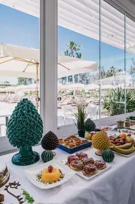 a table with a buffet of food on it at Mangia's Himera Resort in Campofelice di Roccella