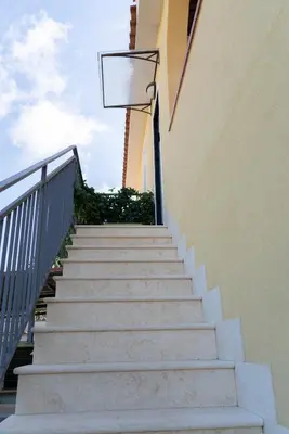 a staircase with a basketball hoop on the side of a building at Villa Claudia e Simone in Carini