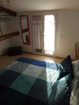 a bedroom with a bed in a room with a window at I Cavalieri di Malta in Palermo