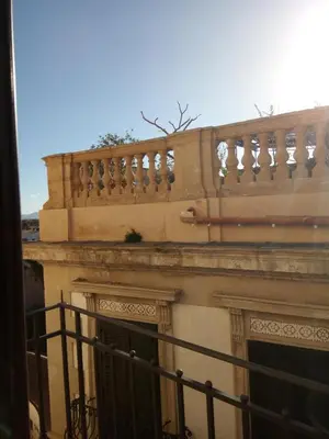 a balcony of a building with a fence at I Cavalieri di Malta in Palermo