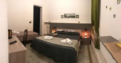 a bedroom with a bed with towels on it at BONORUM in Palermo