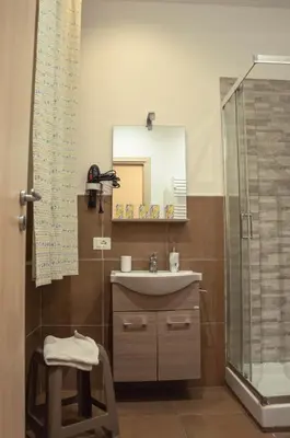 a bathroom with a sink and a shower at BONORUM in Palermo