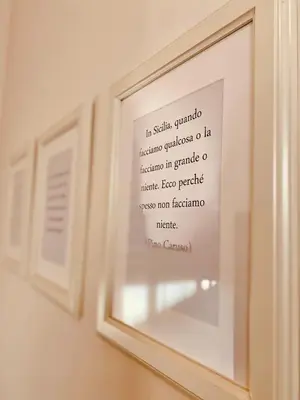 a picture of a framed picture on a wall at Mamamia #Politeama in Palermo