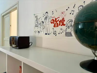 a white shelf with a microwave and a globe on it at Mamamia #Politeama in Palermo