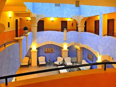 a view of a room with chairs in a building at Residence in Sicily near Himera & Madonie Park in Buonfornello
