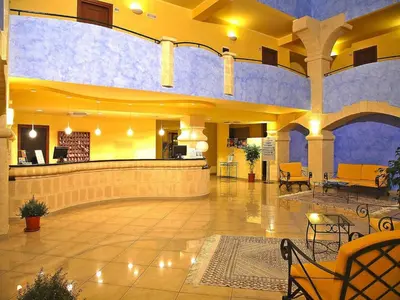 a lobby with a waiting area in a building at Residence in Sicily near Himera & Madonie Park in Buonfornello