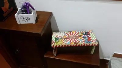 a stool sitting on top of a dresser at Casa Ruggiero in Palermo