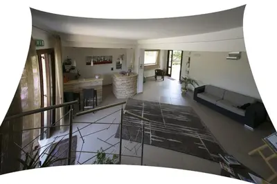 an aerial view of a living room with a couch at Trigrana Vacanze Hotel in Castelluzzo