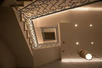 a room with a mirror and a light on the wall at Cocciu d'amuri in San Vito lo Capo
