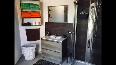 a bathroom with a sink and a shower at Villa Araucaria in Partinico
