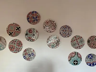 a bunch of plates hanging on a wall at B&B Palazzo Corselli in Bagheria