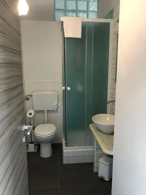 a bathroom with a toilet and a sink at Beb oasi marina in Campofelice di Roccella