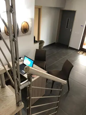 an office with a desk with a laptop on it at Beb oasi marina in Campofelice di Roccella