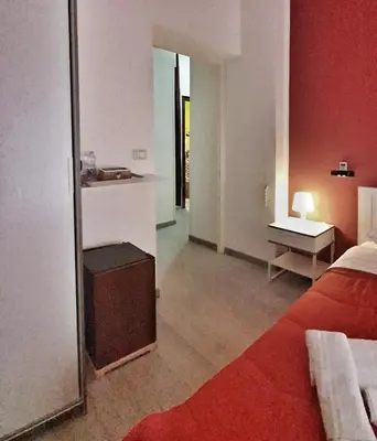 a hotel room with a bed and a mirror at A un passo dal centro in Palermo