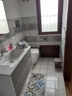 a bathroom with a sink and a toilet at Villa Grisì in Partinico