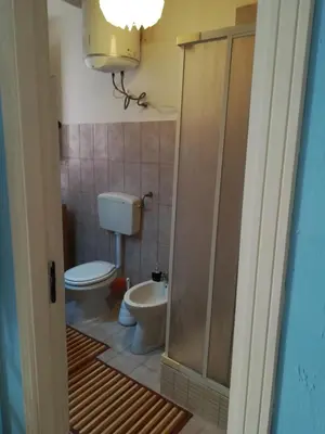 a bathroom with a toilet and a sink at casa in palazzo Graffeo Eva in Palermo