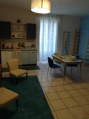 a kitchen and dining room with a table and chairs at casa in palazzo Graffeo Eva in Palermo