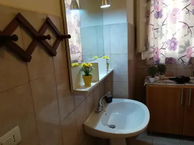a bathroom with a sink and a mirror at casa in palazzo Graffeo Eva in Palermo