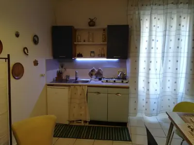 a kitchen with a sink and a shower curtain at casa in palazzo Graffeo Eva in Palermo