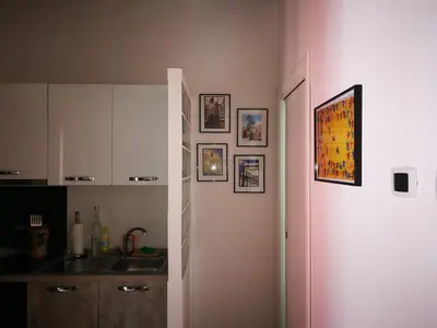 a kitchen with a sink and a white refrigerator at Stranizza d'amuri, al Capo vero cuore di Palermo vedi anche atocà1 in Palermo
