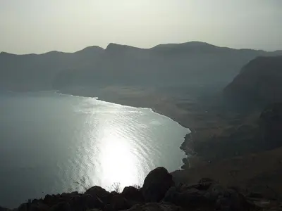 a view of a large body of water with mountains at Al Cantuccio in Castelluzzo