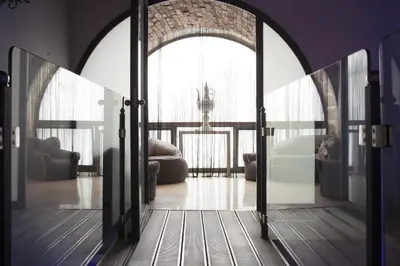 an open door in a room with a living room at Quintocanto Hotel & Spa in Palermo