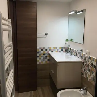 a bathroom with a sink and a mirror at Casa Vacanza Mar' illù in Castellammare del Golfo
