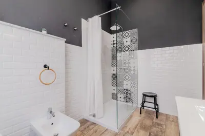a bathroom with a shower and a toilet and a sink at Panurban Rooms by Wonderful Italy in Palermo