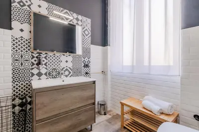 a bathroom with a sink and a mirror at Panurban Rooms by Wonderful Italy in Palermo
