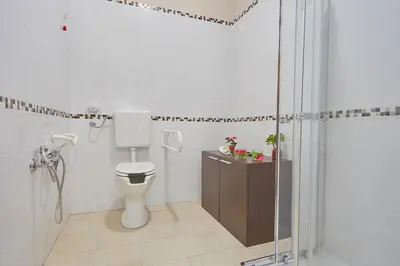 a bathroom with a toilet and a shower at Sturzo 44 in Palermo