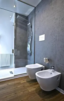 a bathroom with a shower and a toilet and a sink at Bed in Spa in Palermo