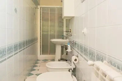 a bathroom with a toilet and a sink at B&B Elvira Al Duomo in Monreale