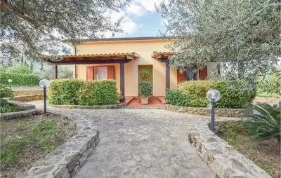 a house with a walkway in front of it at Casa Antonio in Mandra Capreria