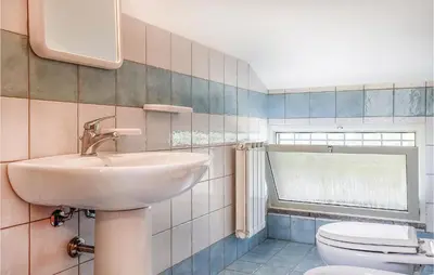 a bathroom with a sink and a toilet at Casa Antonio in Mandra Capreria