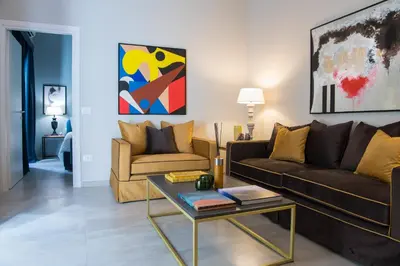a living room with a couch and a table at A&G Dimore di Famiglia - Un Lusso Garbato in Palermo