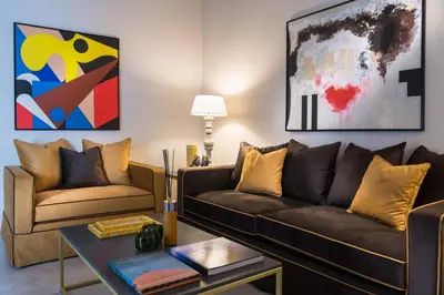 a living room with two couches and a table at A&G Dimore di Famiglia - Un Lusso Garbato in Palermo