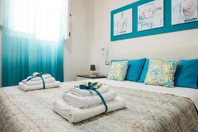 a bedroom with two beds with towels on them at BENVENUTI AL SUD in Castellammare del Golfo