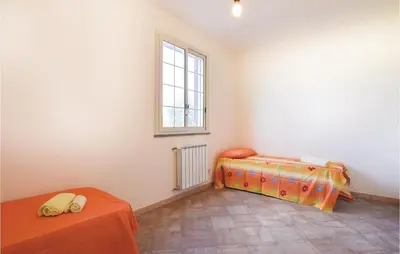 a room with two beds and a window at Casa Sardina in Mandra Capreria