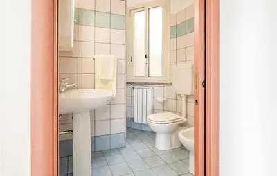 a bathroom with a toilet and a sink at Casa Sardina in Mandra Capreria