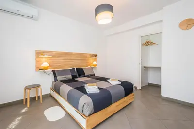 a bedroom with a large bed in a room at B&B Lo&G in Lascari
