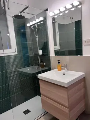 a bathroom with a sink and a shower at Sammartino 108 in Palermo