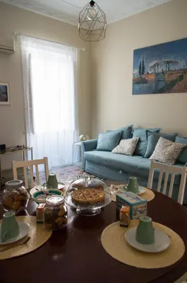 a living room with a table with food on it at Sammartino 108 in Palermo